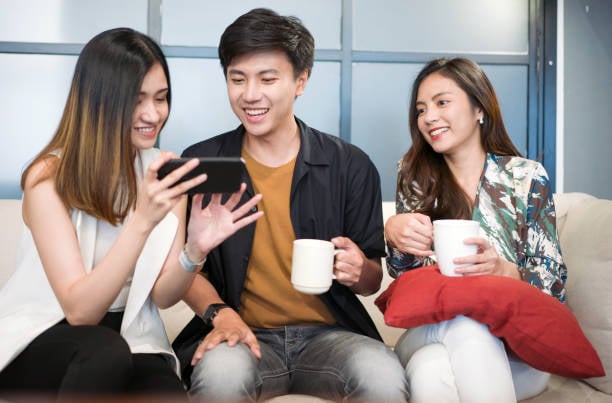 Portrait young asian creative business person working success project with team Business people weare casual suit outfit working happy action in modern Coworking space